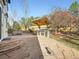 Backyard with a built-in outdoor kitchen, stone patio, and hot tub at 10672 Wintersweet Pl, Parker, CO 80134