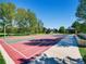 Outdoor basketball court with hoops and a smooth surface in a park-like setting with trees and gazebos at 10672 Wintersweet Pl, Parker, CO 80134