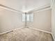 Bedroom with carpet flooring, neutral walls, and a corner window with blinds at 10672 Wintersweet Pl, Parker, CO 80134