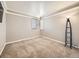 Cozy bedroom with carpet flooring, neutral walls, and a large window with blinds at 10672 Wintersweet Pl, Parker, CO 80134