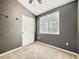 Bedroom features a closet, large window with blinds, and neutral carpet and paint at 10672 Wintersweet Pl, Parker, CO 80134