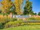 Stonegate neighborhood sign with seasonal plants at 10672 Wintersweet Pl, Parker, CO 80134