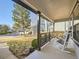 Relaxing covered front porch features decorative railings and comfortable seating to enjoy the view at 10672 Wintersweet Pl, Parker, CO 80134