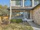 Inviting front porch with decorative railings, a wreath on the door, and manicured landscaping at 10672 Wintersweet Pl, Parker, CO 80134