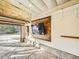 Garage featuring a wall mounted TV, open door, and a concrete floor at 10672 Wintersweet Pl, Parker, CO 80134