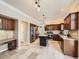 Spacious kitchen with an island, stainless steel appliances, stone countertops and ample storage space at 10672 Wintersweet Pl, Parker, CO 80134