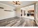 Open-concept living room flows into the kitchen, featuring modern flooring and ample natural light at 10672 Wintersweet Pl, Parker, CO 80134