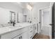 Bright bathroom featuring a double sink vanity with stylish fixtures and ample counter space at 11261 Moonshimmer St, Littleton, CO 80125
