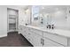 Bright bathroom features a double sink vanity with stylish fixtures and ample counter space at 11261 Moonshimmer St, Littleton, CO 80125