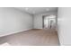 Bright, carpeted room featuring recessed lighting and an entrance to another room at 11261 Moonshimmer St, Littleton, CO 80125