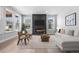 Stylish living room featuring a modern fireplace, large windows, and comfortable seating at 11261 Moonshimmer St, Littleton, CO 80125