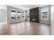 Spacious living room with hardwood floors, a modern fireplace, and plenty of natural light at 11261 Moonshimmer St, Littleton, CO 80125