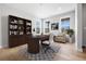 Bright home office features a desk, bookshelves, a comfortable chair, and multiple windows that let in natural light at 11261 Moonshimmer St, Littleton, CO 80125