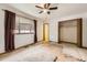 Bright bedroom with a closet and neutral walls, ready for personal touches at 671 Brentwood St, Lakewood, CO 80214