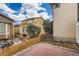 Cozy backyard featuring a brick patio, a partial fence, and a swing at 10626 Cherrybrook Cir, Highlands Ranch, CO 80126