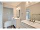 Bright bathroom features double sink vanity, hardwood floors, and a tub with white subway tile at 10626 Cherrybrook Cir, Highlands Ranch, CO 80126