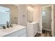 Bright bathroom features double sink vanity, hardwood floors, and a separate toilet room at 10626 Cherrybrook Cir, Highlands Ranch, CO 80126