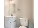 Clean bathroom featuring a white vanity, toilet, and modern fixtures at 10626 Cherrybrook Cir, Highlands Ranch, CO 80126