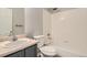 Well lit bathroom features a tub, toilet, and sink at 10626 Cherrybrook Cir, Highlands Ranch, CO 80126