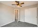 Bedroom features soft carpet, a closet, neutral paint, bright window, and a ceiling fan at 10626 Cherrybrook Cir, Highlands Ranch, CO 80126