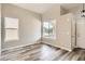 Bright and spacious living room with high ceilings, large windows, and stylish wood-look flooring at 10626 Cherrybrook Cir, Highlands Ranch, CO 80126