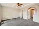 Spacious main bedroom with neutral colors, carpet, closet, and bathroom access at 10626 Cherrybrook Cir, Highlands Ranch, CO 80126