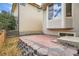 A brick patio is bordered by a stone retaining wall at 10626 Cherrybrook Cir, Highlands Ranch, CO 80126