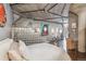 Bedroom with glass block partition and exposed ductwork at 1863 Wazee St # 6B, Denver, CO 80202