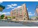 Exterior view of the brick apartment building on a sunny day with street view at 1863 Wazee St # 6B, Denver, CO 80202