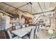 Open-concept dining room features a modern chandelier, gray leather chairs, and lots of space for entertaining at 1863 Wazee St # 6B, Denver, CO 80202