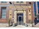 Exterior of building entrance with glass doors, planters, and brick facade at 1863 Wazee St # 6B, Denver, CO 80202