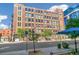 Street view of brick building featuring many windows, trees, and sidewalk at 1863 Wazee St # 6B, Denver, CO 80202