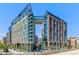 View of building with glass bridge and balconies at 1863 Wazee St # 6B, Denver, CO 80202