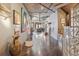 Spacious hallway with high ceilings, unique decor, and views into the main living area at 1863 Wazee St # 6B, Denver, CO 80202