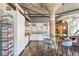 Modern kitchen with stainless steel appliances, mosaic backsplash, and an island with bar seating at 1863 Wazee St # 6B, Denver, CO 80202