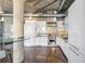 Modern kitchen featuring sleek white cabinets, stainless steel appliances, and a mosaic backsplash at 1863 Wazee St # 6B, Denver, CO 80202