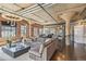 Open-concept living room featuring exposed brick, industrial-style ceiling, and modern decor at 1863 Wazee St # 6B, Denver, CO 80202