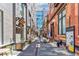 Outdoor seating area with string lights and brick buildings at 1863 Wazee St # 6B, Denver, CO 80202
