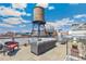 Entertain on this rooftop patio with comfortable seating, green plants and city views at 1863 Wazee St # 6B, Denver, CO 80202
