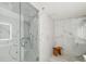 A bright, marble walk-in shower with glass doors and rainfall shower head at 1863 Wazee St # 6B, Denver, CO 80202