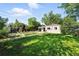Spacious backyard with a well-maintained lawn, garden beds, and a shed for outdoor enjoyment at 4315 S Elati St, Englewood, CO 80110
