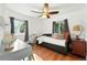 Sunlit bedroom features hardwood floors, a ceiling fan, and a cozy daybed at 4315 S Elati St, Englewood, CO 80110