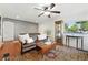 Cozy living room with hardwood floors, comfortable seating, and a decorative display cabinet at 4315 S Elati St, Englewood, CO 80110