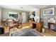 Bright living room with a dining area, desk, and hardwood floors for a flexible living space at 4315 S Elati St, Englewood, CO 80110