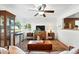 Bright living room with hardwood floors, ceiling fan, and large window offering ample natural light at 4315 S Elati St, Englewood, CO 80110