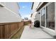 Relax on this concrete back patio perfect for grilling and chilling with an outdoor table set at 1103 Spartan Ave, Berthoud, CO 80513