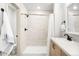 Modern bathroom featuring a walk-in shower, updated vanity, and contemporary fixtures at 1103 Spartan Ave, Berthoud, CO 80513