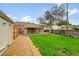 A backyard features a covered patio, a detached garage, and ample green space at 641 E 104Th Pl, Northglenn, CO 80233