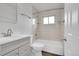 Clean, bright bathroom with a tiled shower-over-tub, modern fixtures, and ample vanity storage at 641 E 104Th Pl, Northglenn, CO 80233