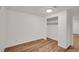 A bright bedroom featuring wood floors and an open closet, providing ample space and storage at 641 E 104Th Pl, Northglenn, CO 80233